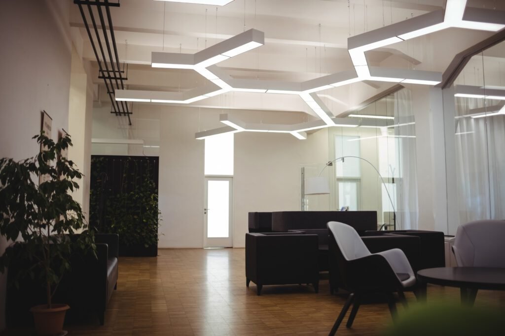 View of empty modern office with sofa, table, chair